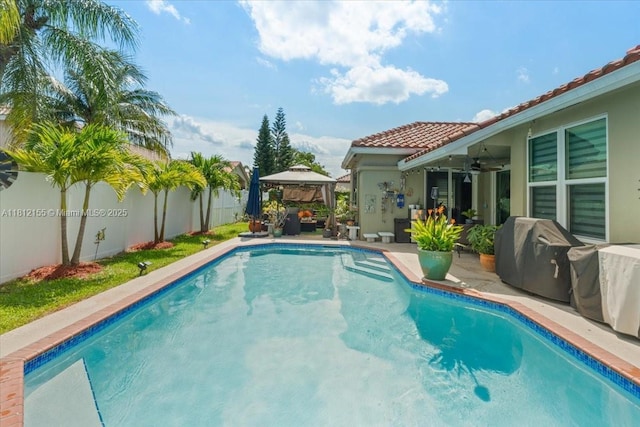 18342 NW 11th St, Pembroke Pines, FL 33029 - outdoor pool featuring a gazebo, ceiling fan, a fenced backyard, a grill, and a patio