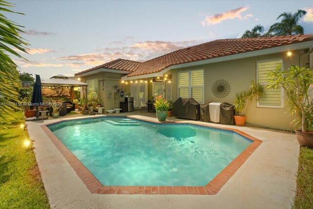 18342 NW 11th St, Pembroke Pines, FL 33029 - outdoor pool featuring a gazebo, a grill, and a patio