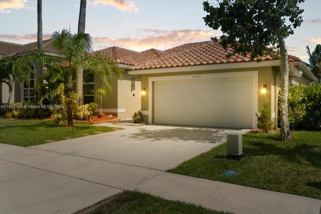 18342 NW 11th St, Pembroke Pines, FL 33029 - mediterranean / spanish home with an attached garage, stucco siding, a tile roof, concrete driveway, and a front yard