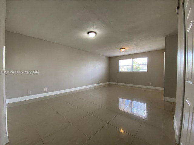 7521 Granada Blvd, Miramar, FL 33023 - spare room with baseboards and tile patterned flooring
