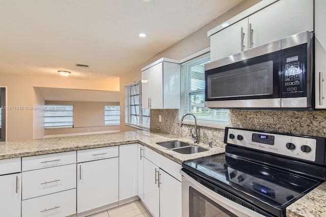 7521 Granada Blvd, Miramar, FL 33023 - kitchen with stainless steel appliances, a sink, tasteful backsplash, healthy amount of natural light, and recessed lighting