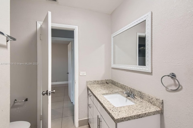 7521 Granada Blvd, Miramar, FL 33023 - bathroom featuring vanity, tile patterned floors, and toilet