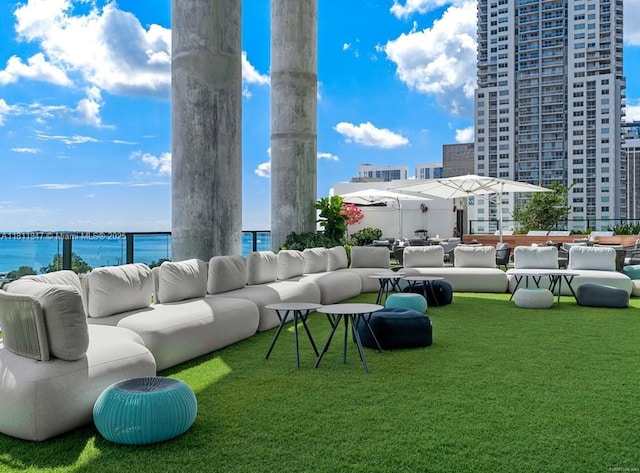 398 NE 5th St Unit 2704, Miami, FL 33132 - surrounding community with an outdoor hangout area, a water view, and a yard