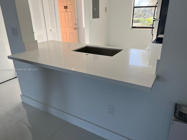 5200 NW 31st Ave Unit 14, Fort Lauderdale, FL 33309 - kitchen featuring electric panel and a peninsula