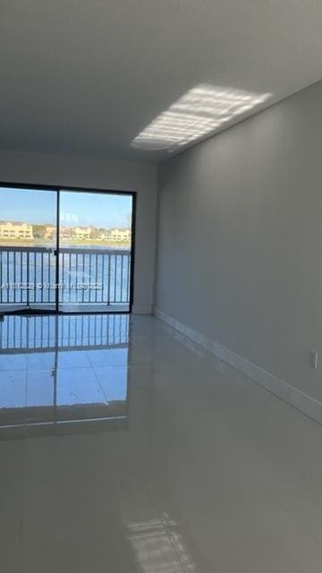 5200 NW 31st Ave Unit 14, Fort Lauderdale, FL 33309 - empty room featuring baseboards