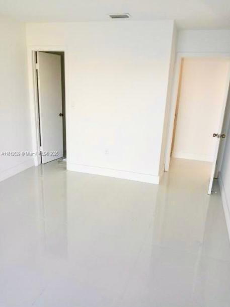 5200 NW 31st Ave Unit 14, Fort Lauderdale, FL 33309 - tiled spare room with baseboards