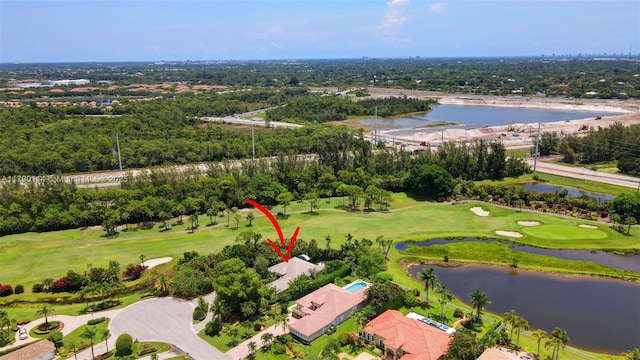 8244 Lakeview Dr, West Palm Beach, FL 33412 - drone / aerial view of a nearby body of water, a tree filled landscape, and a local golf course