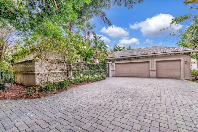 8244 Lakeview Dr, West Palm Beach, FL 33412 - garage featuring decorative driveway