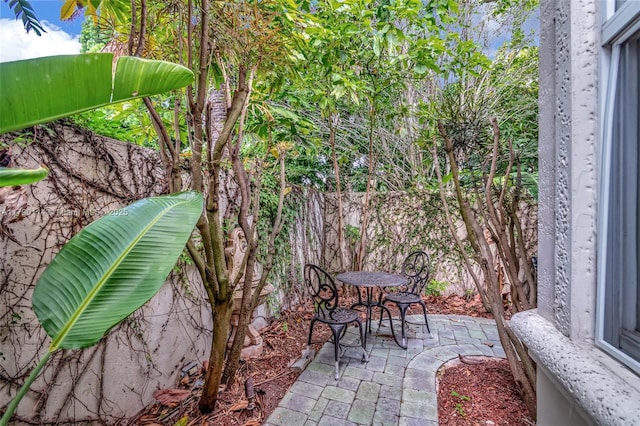 8244 Lakeview Dr, West Palm Beach, FL 33412 - fenced backyard featuring a patio