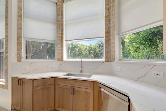 8244 Lakeview Dr, West Palm Beach, FL 33412 - kitchen featuring stainless steel dishwasher, a sink, decorative backsplash, and light stone countertops