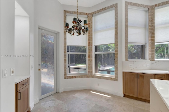8244 Lakeview Dr, West Palm Beach, FL 33412 - unfurnished dining area featuring a chandelier