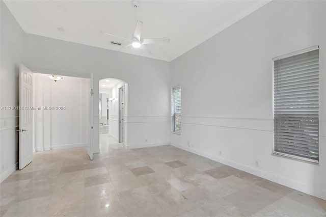 8244 Lakeview Dr, West Palm Beach, FL 33412 - unfurnished room featuring arched walkways, a ceiling fan, and baseboards