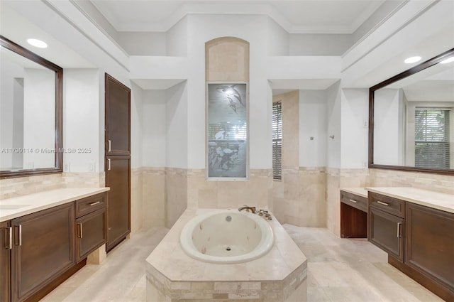 8244 Lakeview Dr, West Palm Beach, FL 33412 - bathroom featuring two vanities, a tub with jets, and crown molding