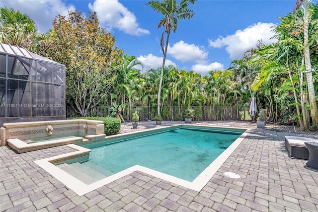 8244 Lakeview Dr, West Palm Beach, FL 33412 - view of swimming pool with a patio area, glass enclosure, and a pool with connected hot tub