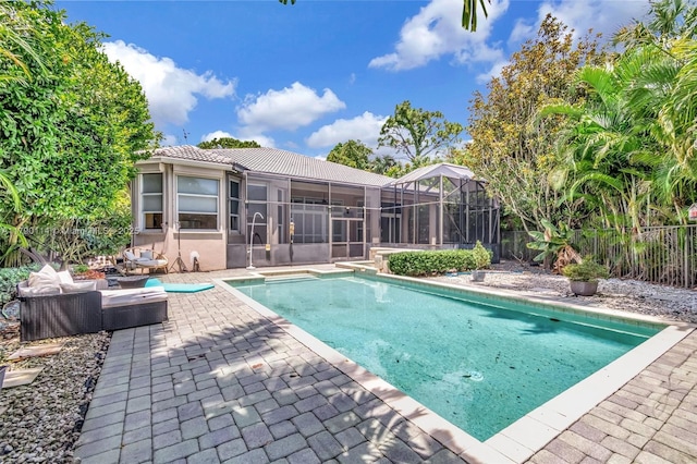 8244 Lakeview Dr, West Palm Beach, FL 33412 - view of swimming pool featuring a patio, a sunroom, and an outdoor living space