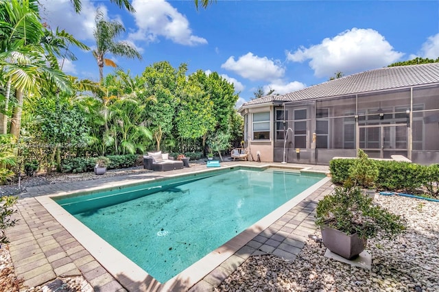 8244 Lakeview Dr, West Palm Beach, FL 33412 - swimming pool with a sunroom and a patio