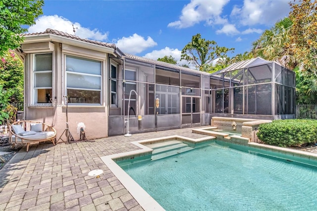 8244 Lakeview Dr, West Palm Beach, FL 33412 - view of pool with a patio, glass enclosure, and a pool with connected hot tub