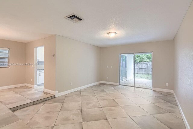 9353 SW 1st Pl, Boca Raton, FL 33428 - unfurnished room with light tile patterned floors and baseboards