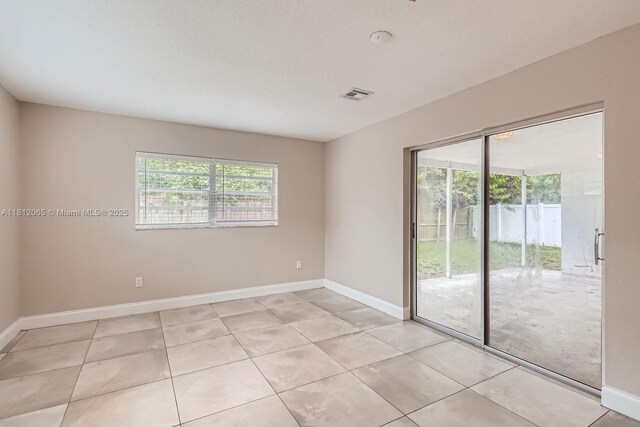 9353 SW 1st Pl, Boca Raton, FL 33428 - spare room featuring baseboards, light tile patterned floors, and a smoke detector