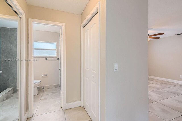 9353 SW 1st Pl, Boca Raton, FL 33428 - corridor featuring light tile patterned floors and baseboards