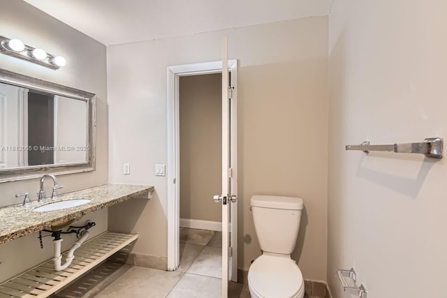 9353 SW 1st Pl, Boca Raton, FL 33428 - bathroom featuring a sink, tile patterned flooring, toilet, and baseboards