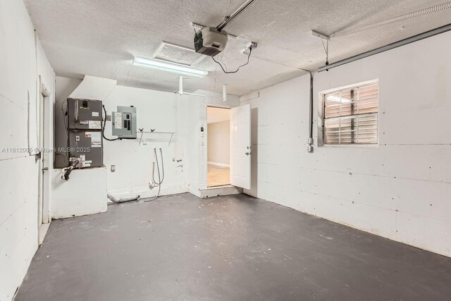 9353 SW 1st Pl, Boca Raton, FL 33428 - garage featuring electric panel, a garage door opener, and heating unit