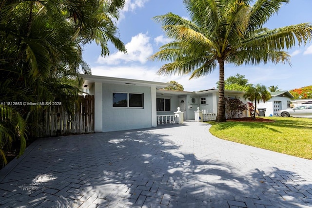7509 Hayes St, Hollywood, FL 33024 - ranch-style house with stucco siding and driveway