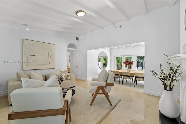 8538 NE 4th Ave, El Portal, FL 33138 - living area featuring arched walkways and baseboards