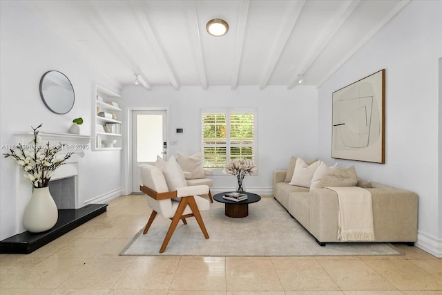 8538 NE 4th Ave, El Portal, FL 33138 - living room featuring beam ceiling, tile patterned floors, and baseboards