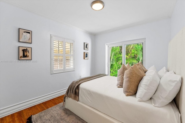 8538 NE 4th Ave, El Portal, FL 33138 - bedroom with crown molding, wood finished floors, and baseboards