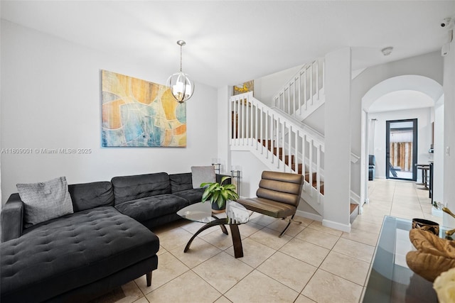 23900 SW 118th Ave, Homestead, FL 33032 - living room with arched walkways, light tile patterned flooring, and stairway