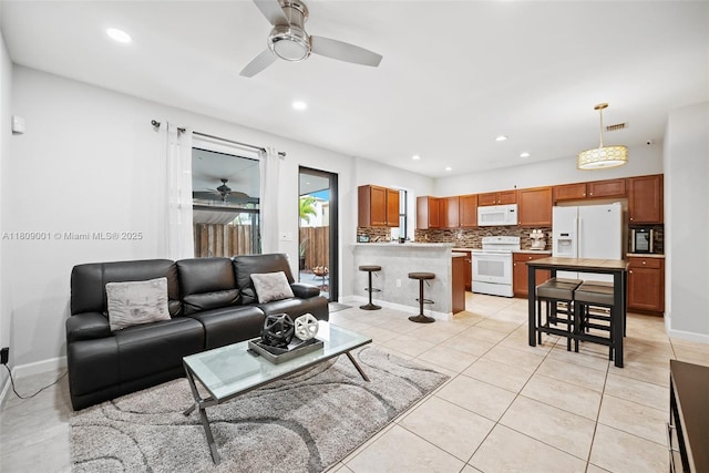 23900 SW 118th Ave, Homestead, FL 33032 - living room featuring ceiling fan, baseboards, light tile patterned floors, and recessed lighting