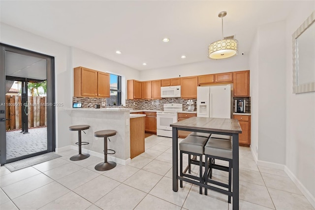 23900 SW 118th Ave, Homestead, FL 33032 - kitchen featuring white appliances, healthy amount of natural light, backsplash, and recessed lighting