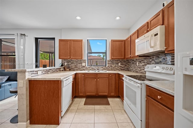 23900 SW 118th Ave, Homestead, FL 33032 - kitchen with white appliances, healthy amount of natural light, a sink, light tile patterned floors, and recessed lighting