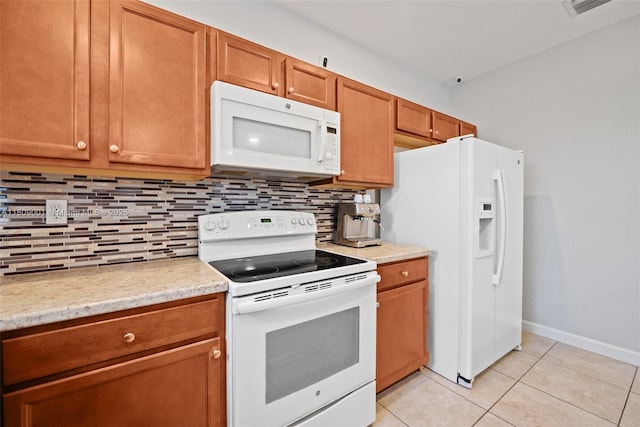 23900 SW 118th Ave, Homestead, FL 33032 - kitchen featuring white appliances, backsplash, light tile patterned flooring, and brown cabinets