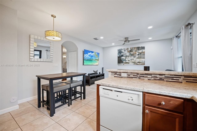 23900 SW 118th Ave, Homestead, FL 33032 - kitchen with white dishwasher, arched walkways, a ceiling fan, pendant lighting, and light tile patterned floors