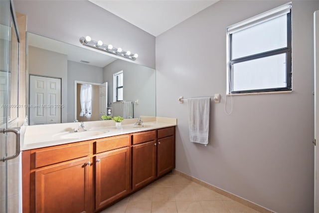 23900 SW 118th Ave, Homestead, FL 33032 - bathroom with double vanity, tile patterned flooring, baseboards, and an enclosed shower
