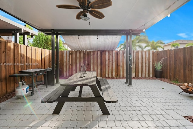 23900 SW 118th Ave, Homestead, FL 33032 - fenced backyard with a ceiling fan and a patio area