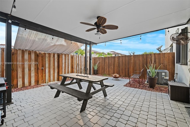 23900 SW 118th Ave, Homestead, FL 33032 - fenced backyard with outdoor dining area, cooling unit, a patio, and ceiling fan