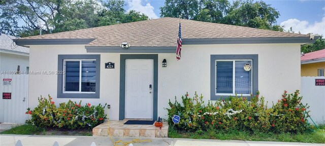 4223 NW 32nd Ave, Miami, FL 33142 - bungalow-style home featuring roof with shingles and stucco siding