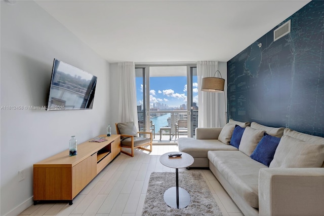 2602 E Hallandale Beach Blvd Unit R1709, Hallandale Beach, FL 33009 - living area with floor to ceiling windows and baseboards
