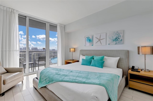 2602 E Hallandale Beach Blvd Unit R1709, Hallandale Beach, FL 33009 - bedroom featuring expansive windows, access to exterior, and a view of city