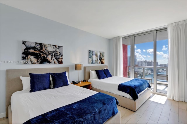 2602 E Hallandale Beach Blvd Unit R1709, Hallandale Beach, FL 33009 - bedroom with access to exterior, floor to ceiling windows, and a city view
