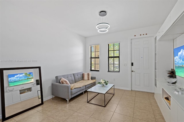 659 NE 191st St, Miami, FL 33179 - living area with light tile patterned floors and baseboards