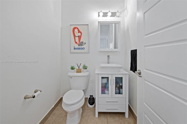 659 NE 191st St, Miami, FL 33179 - bathroom with vanity, toilet, tile patterned floors, and baseboards