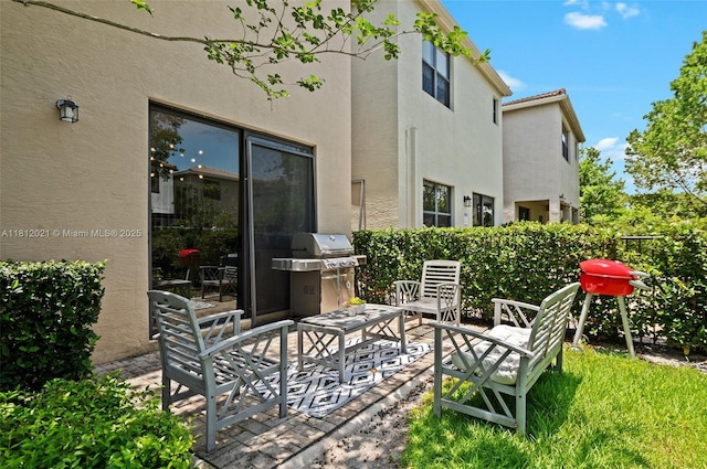 659 NE 191st St, Miami, FL 33179 - view of patio with a grill