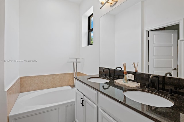 659 NE 191st St, Miami, FL 33179 - full bathroom featuring double vanity and a garden tub