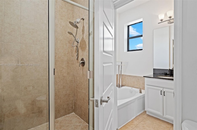 659 NE 191st St, Miami, FL 33179 - full bathroom featuring a shower stall, vanity, a garden tub, tile patterned flooring, and toilet