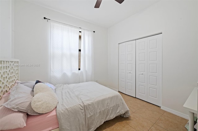 659 NE 191st St, Miami, FL 33179 - tiled bedroom featuring a closet, ceiling fan, and baseboards