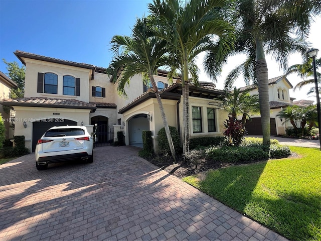 8248 Lost Creek Ln, Delray Beach, FL 33446 - mediterranean / spanish home with decorative driveway, stucco siding, a gate, and a tile roof